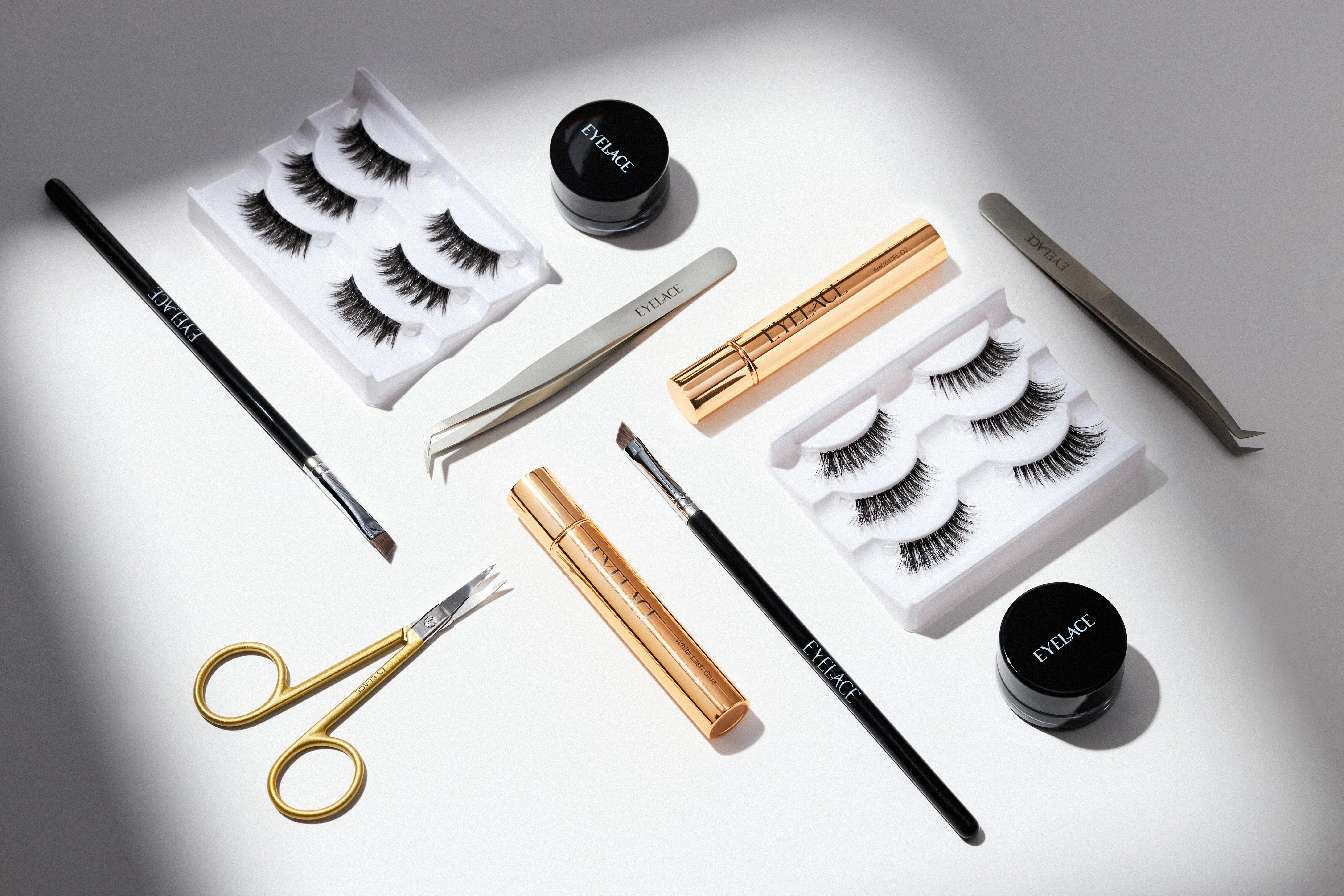 Eyelace accessories collection with lashes, tweezers, and brushes.