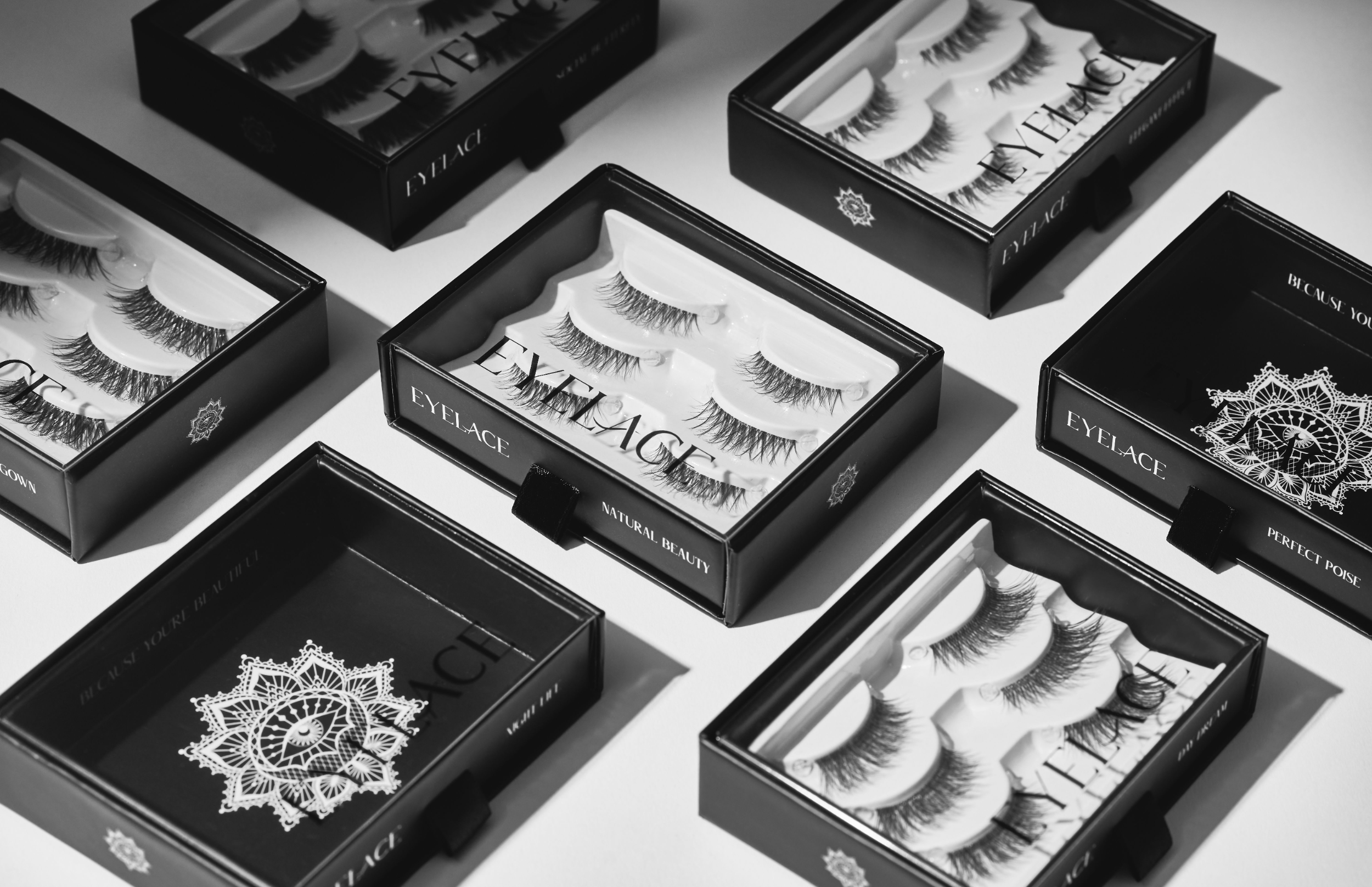 Eyelace accessories collection with lashes, tweezers, and brushes.