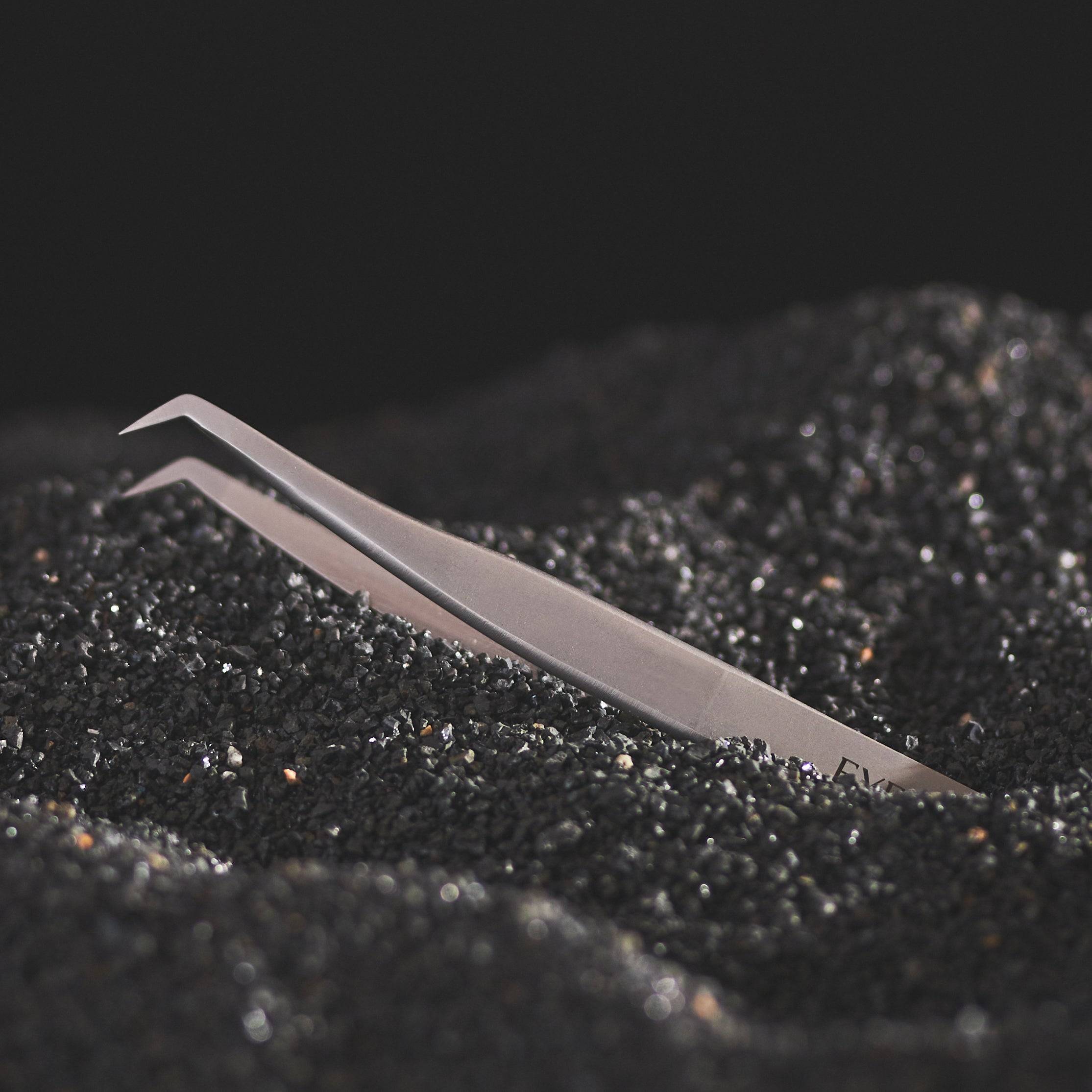 MSA-6B hyperfine tweezers on black textured surface