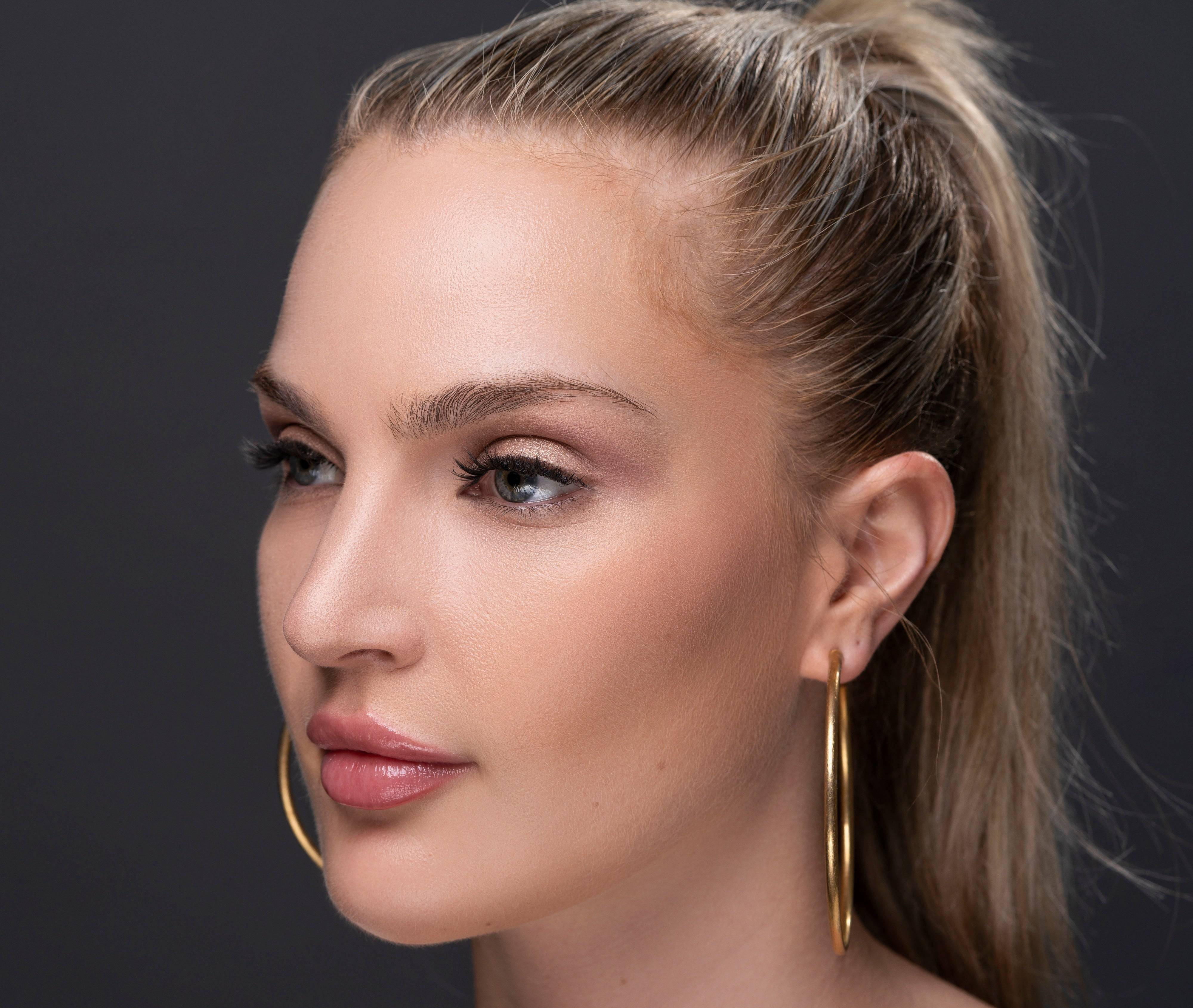Model wearing Social Butterfly lashes, side profile