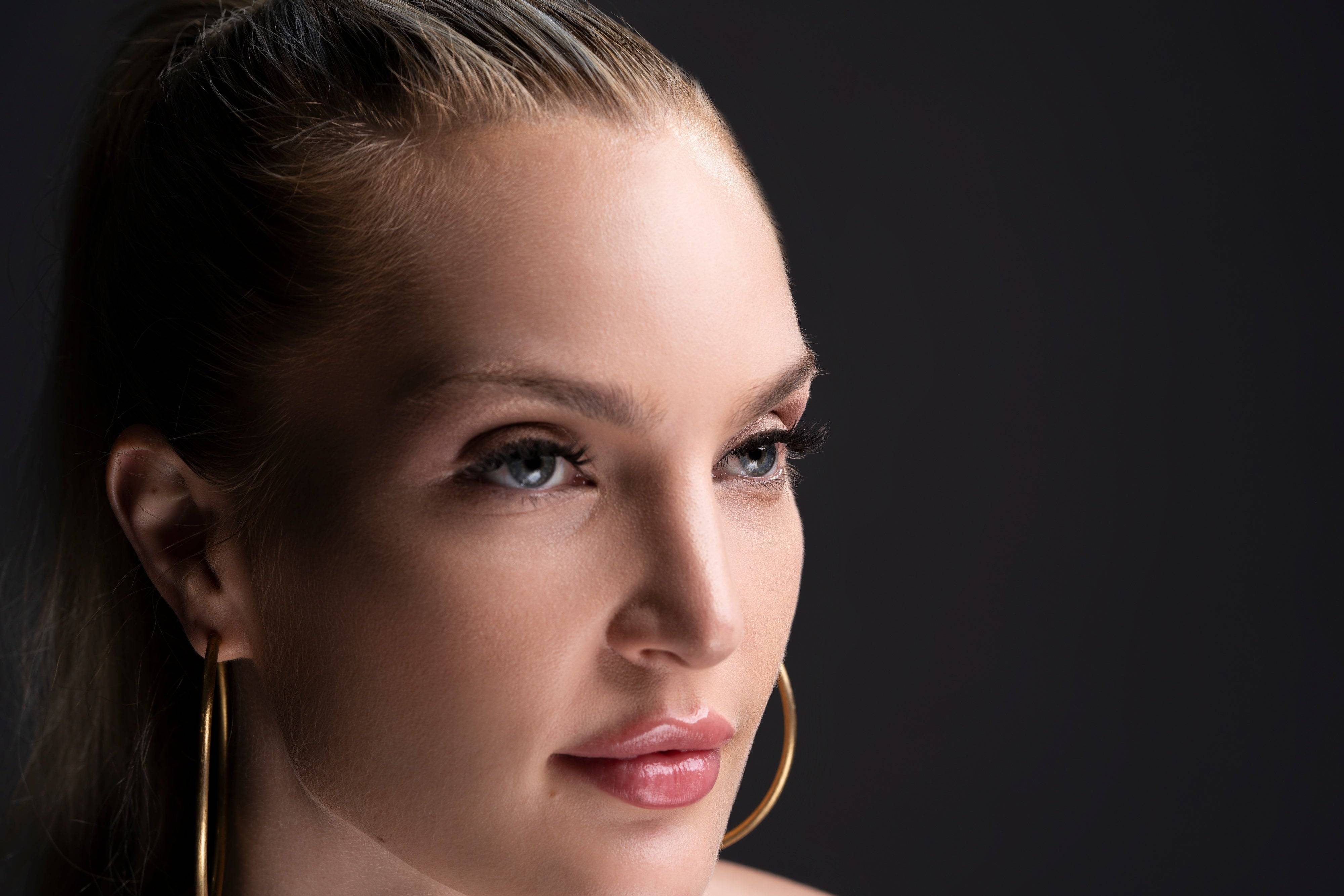 Model looking sideways with Social Butterfly lashes