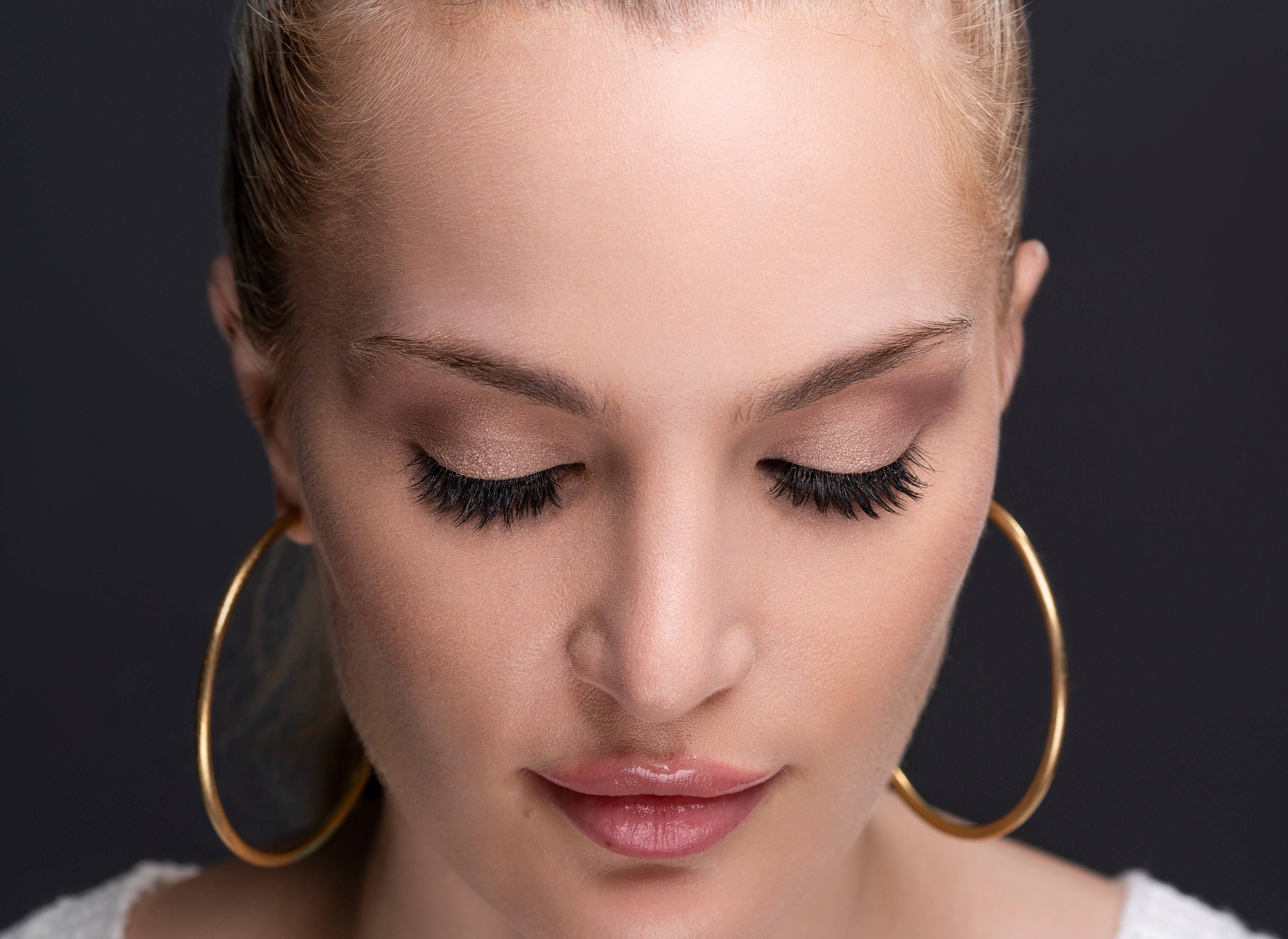 Model with closed eyes showing Social Butterfly lashes