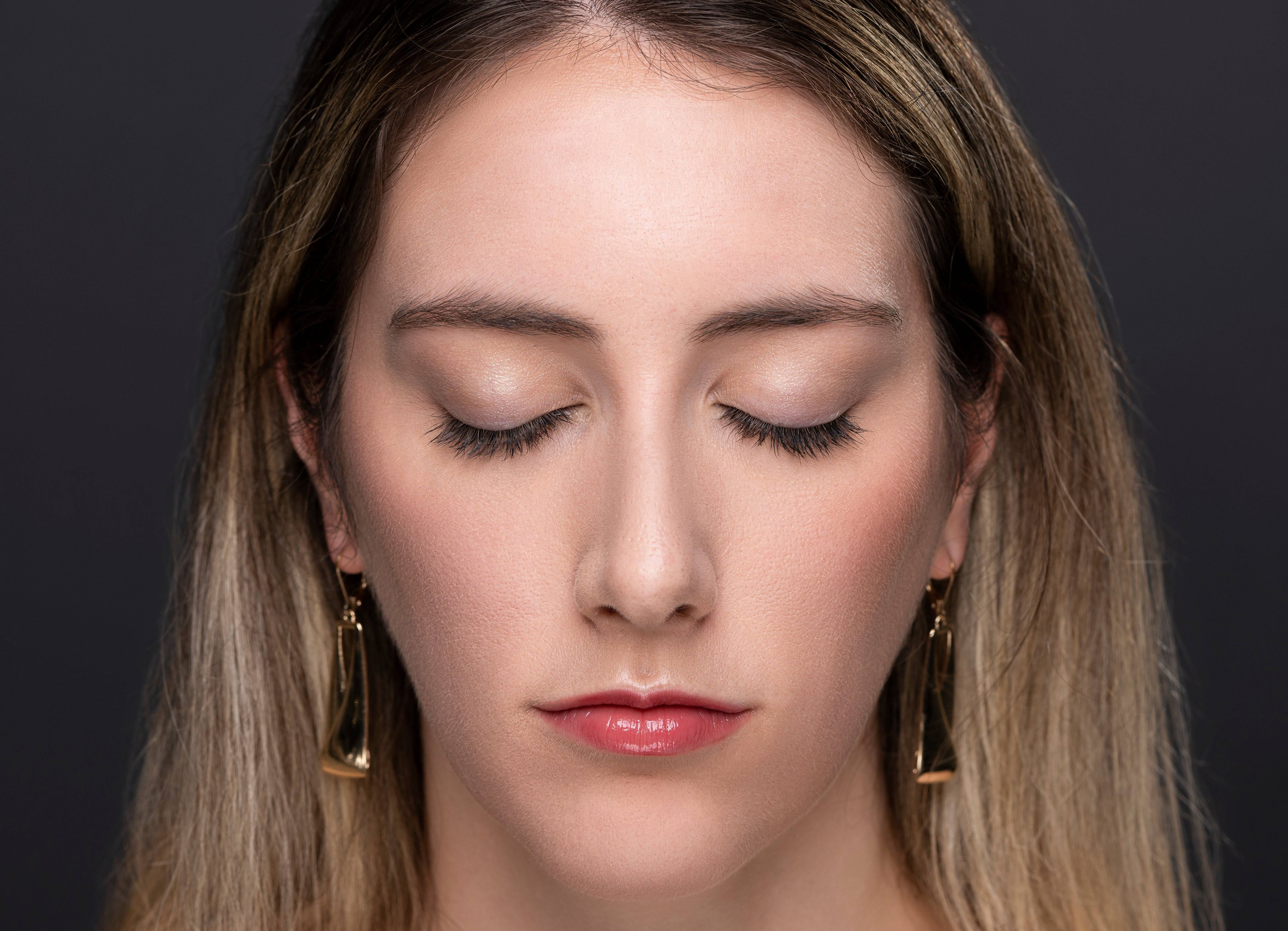 Woman with closed eyes wearing Elegant Effect lashes