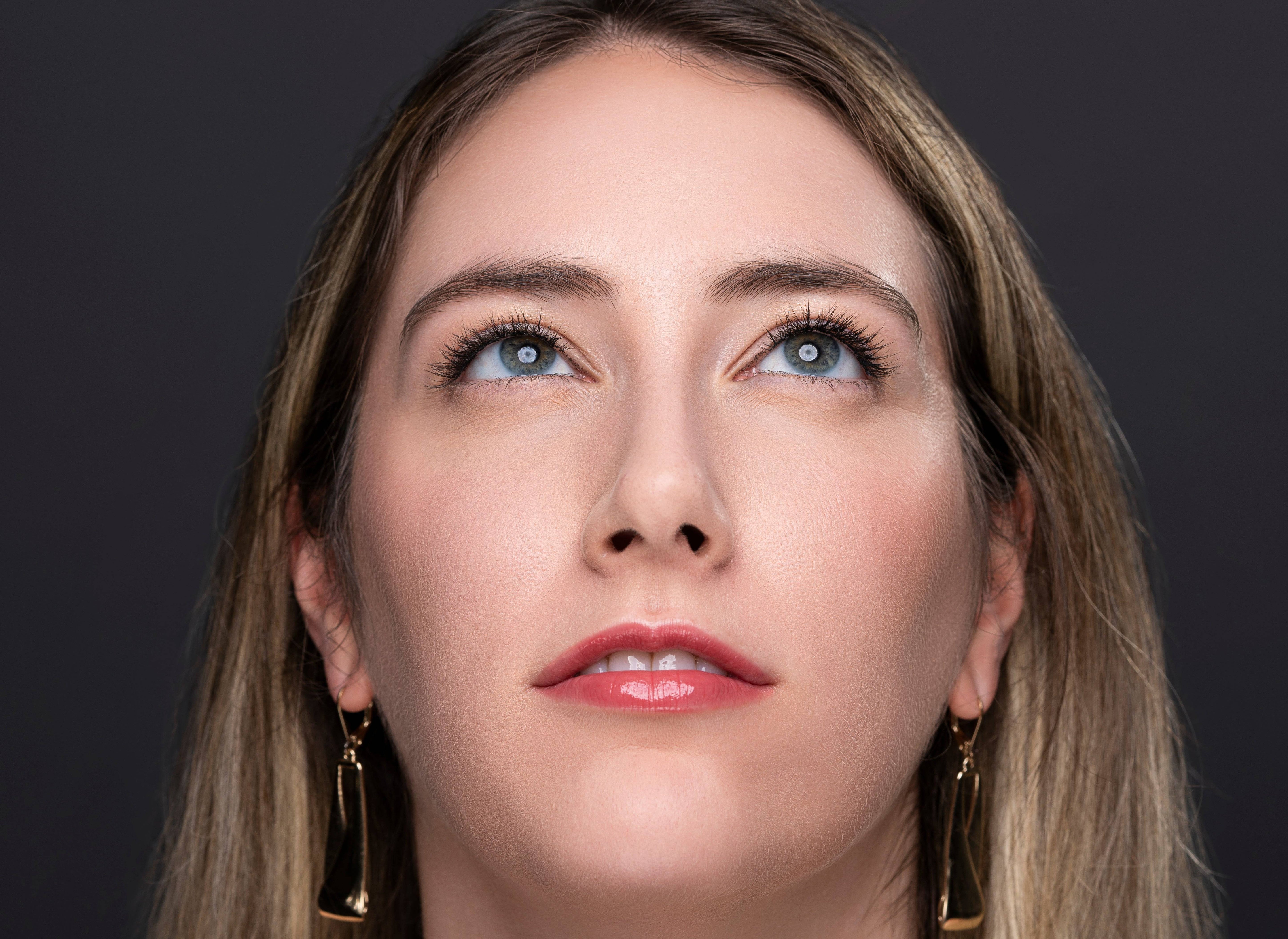 Woman looking up wearing Elegant Effect lashes