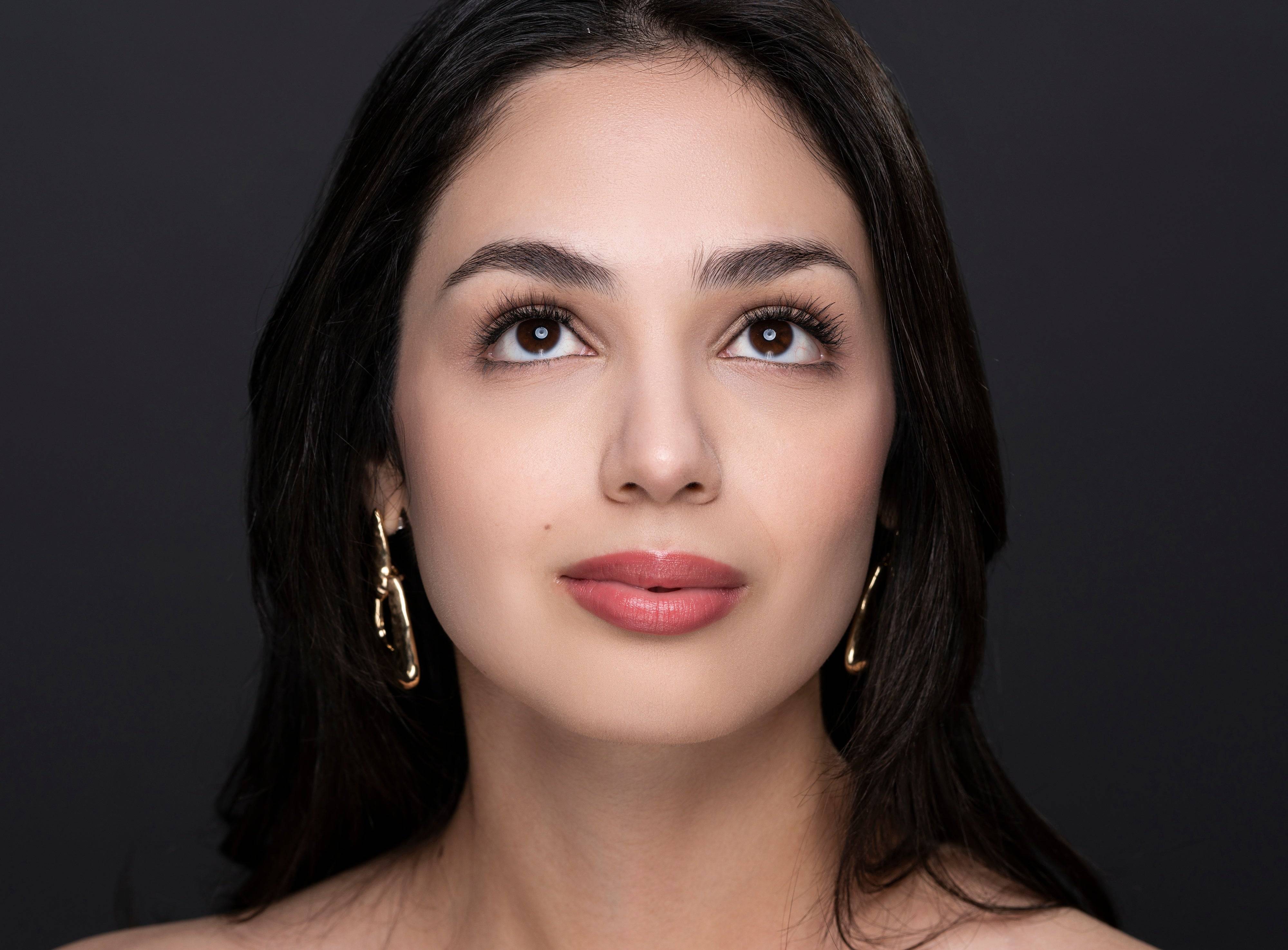Model looking up wearing Natural Beauty Lashes