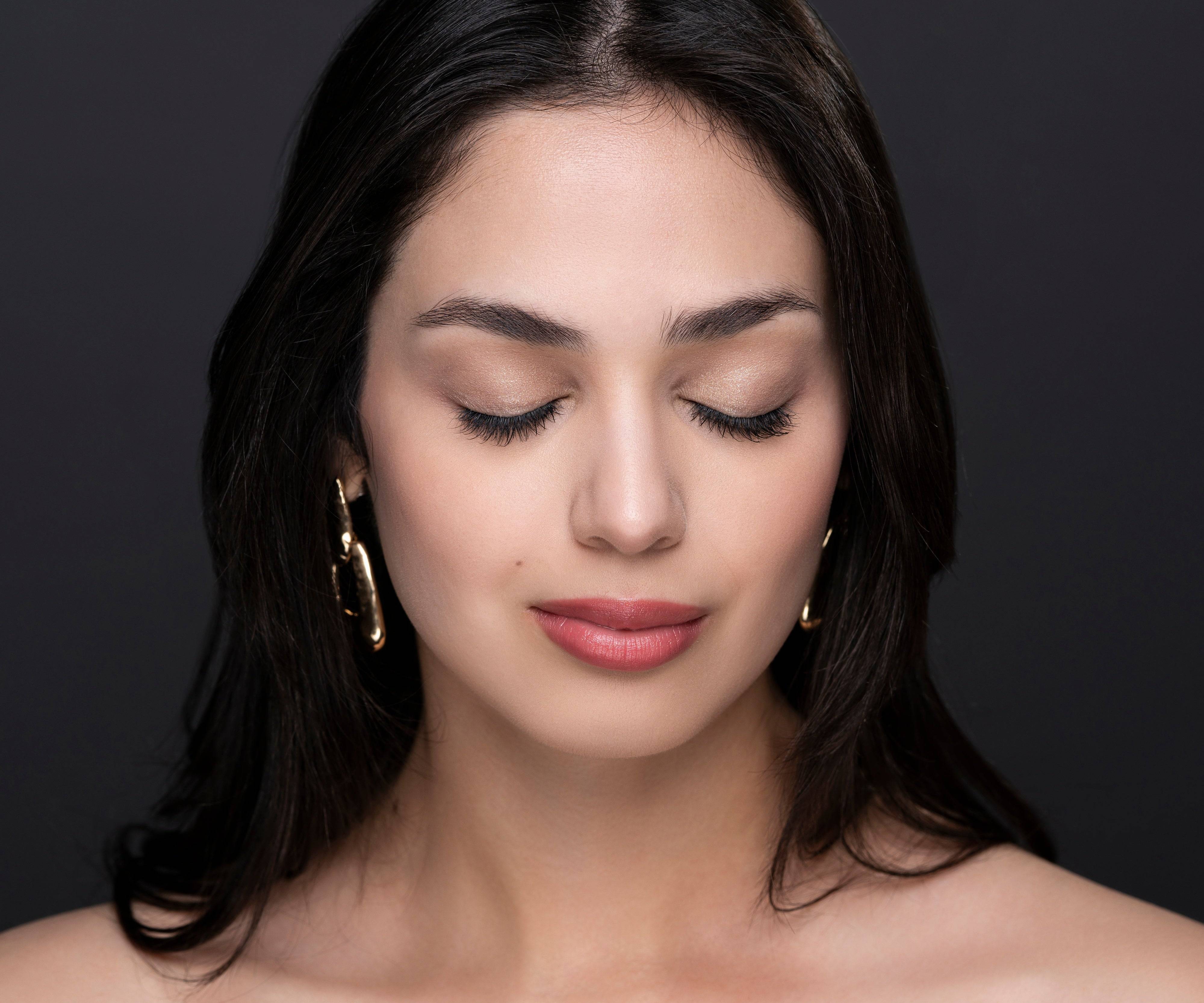 Model with eyes closed wearing Natural Beauty Lashes