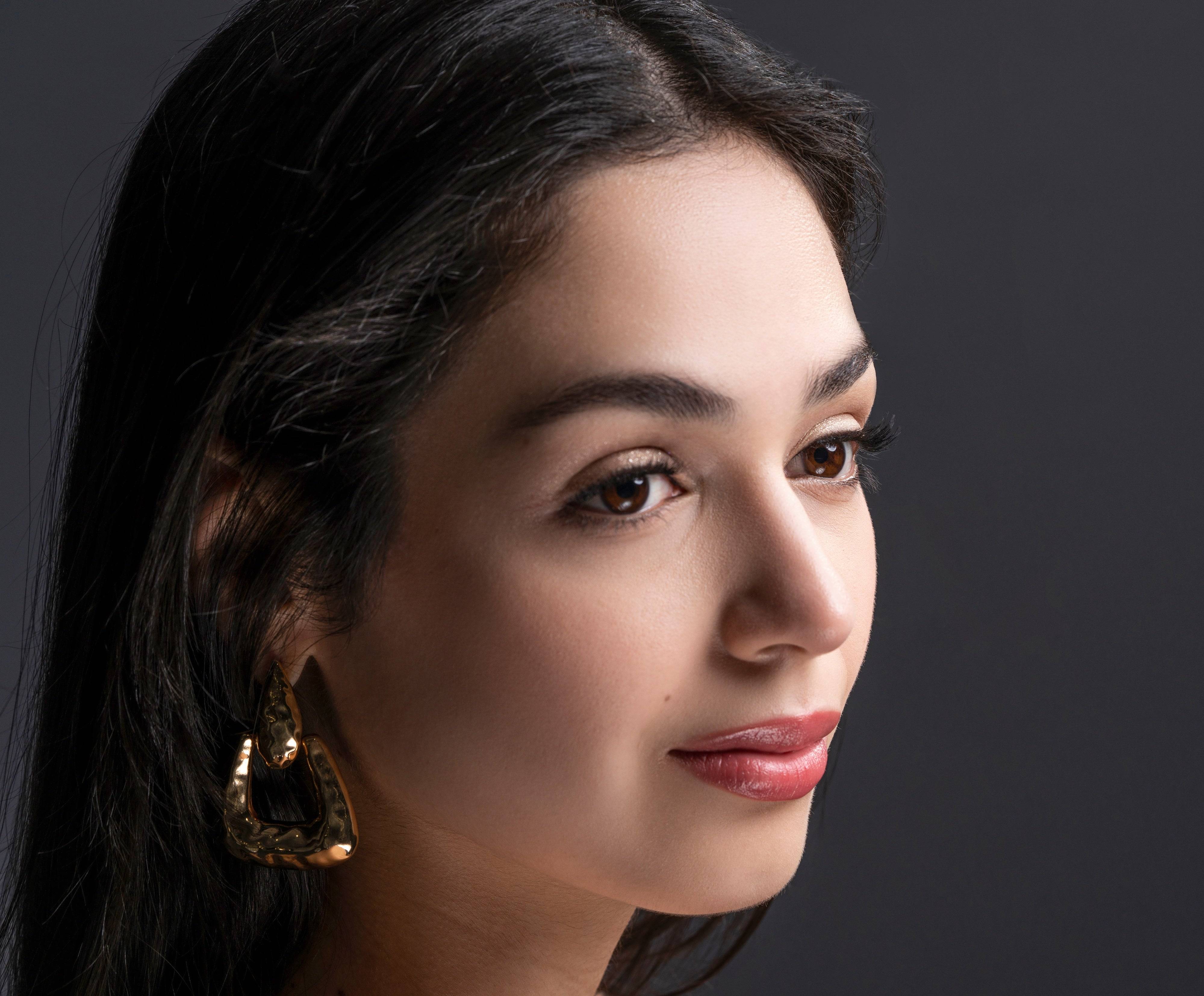 Model in profile wearing Natural Beauty Lashes