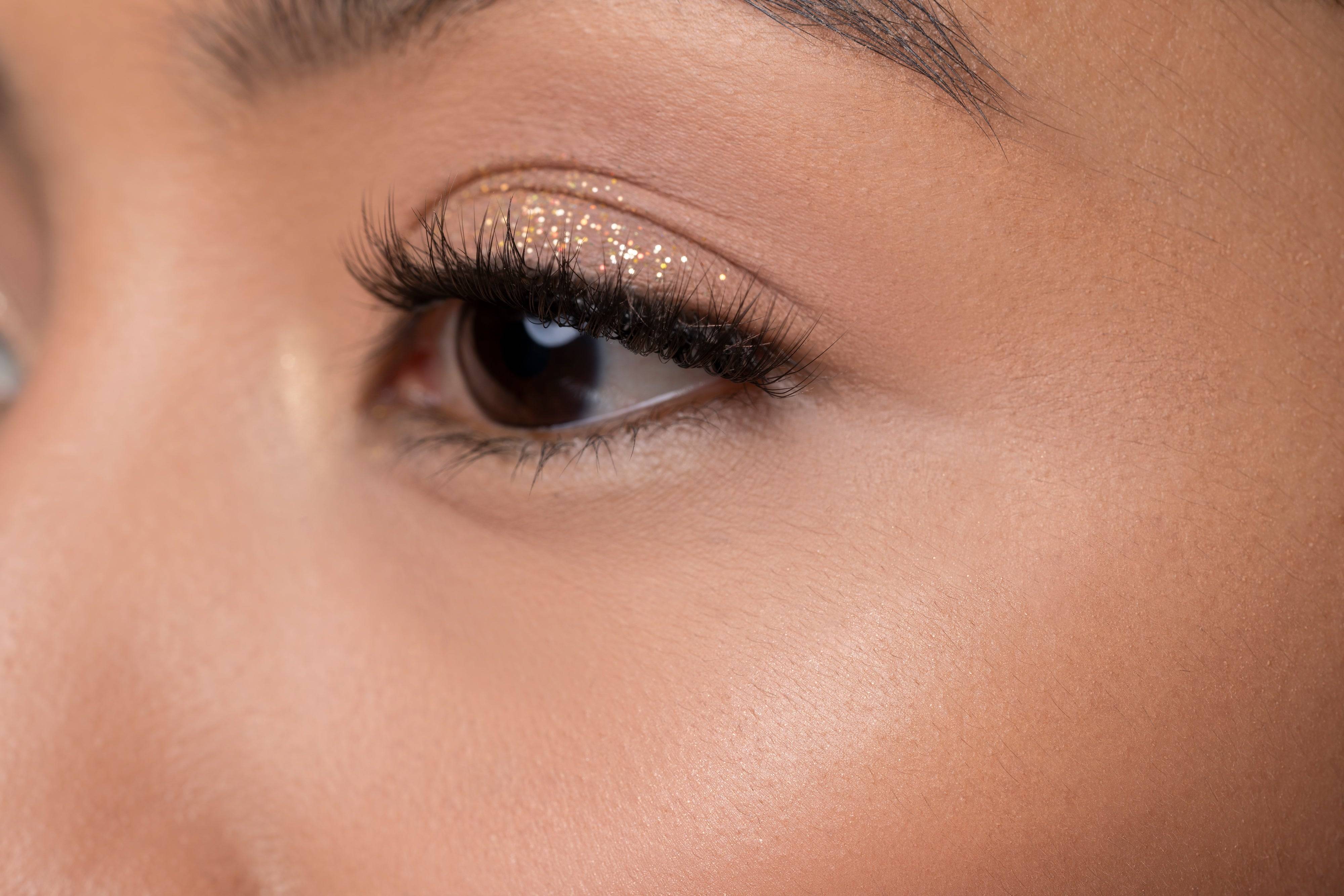 Side view of eye with glitter and Night Life Lash
