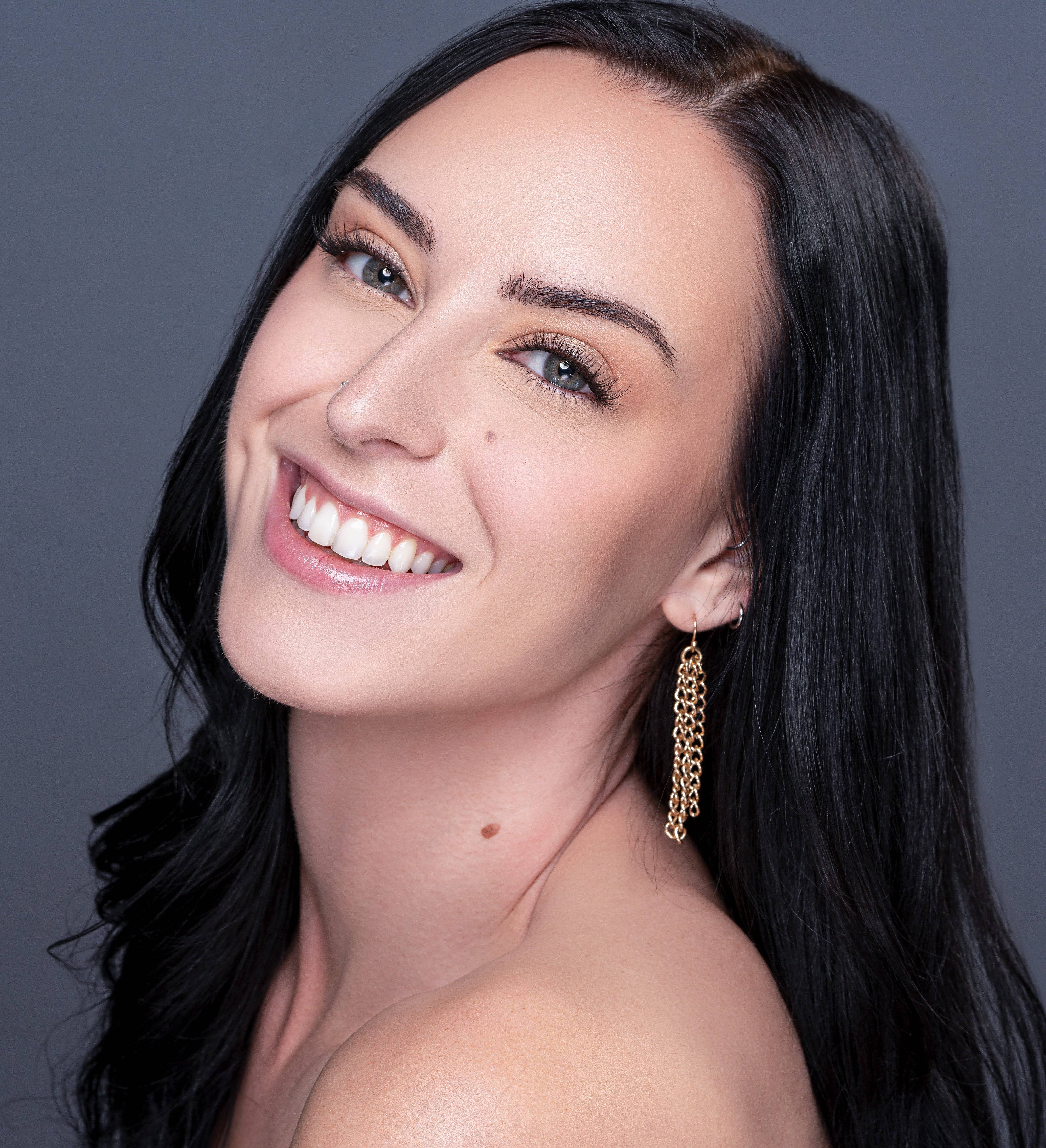 Smiling woman wearing Ball Gown Lash Set