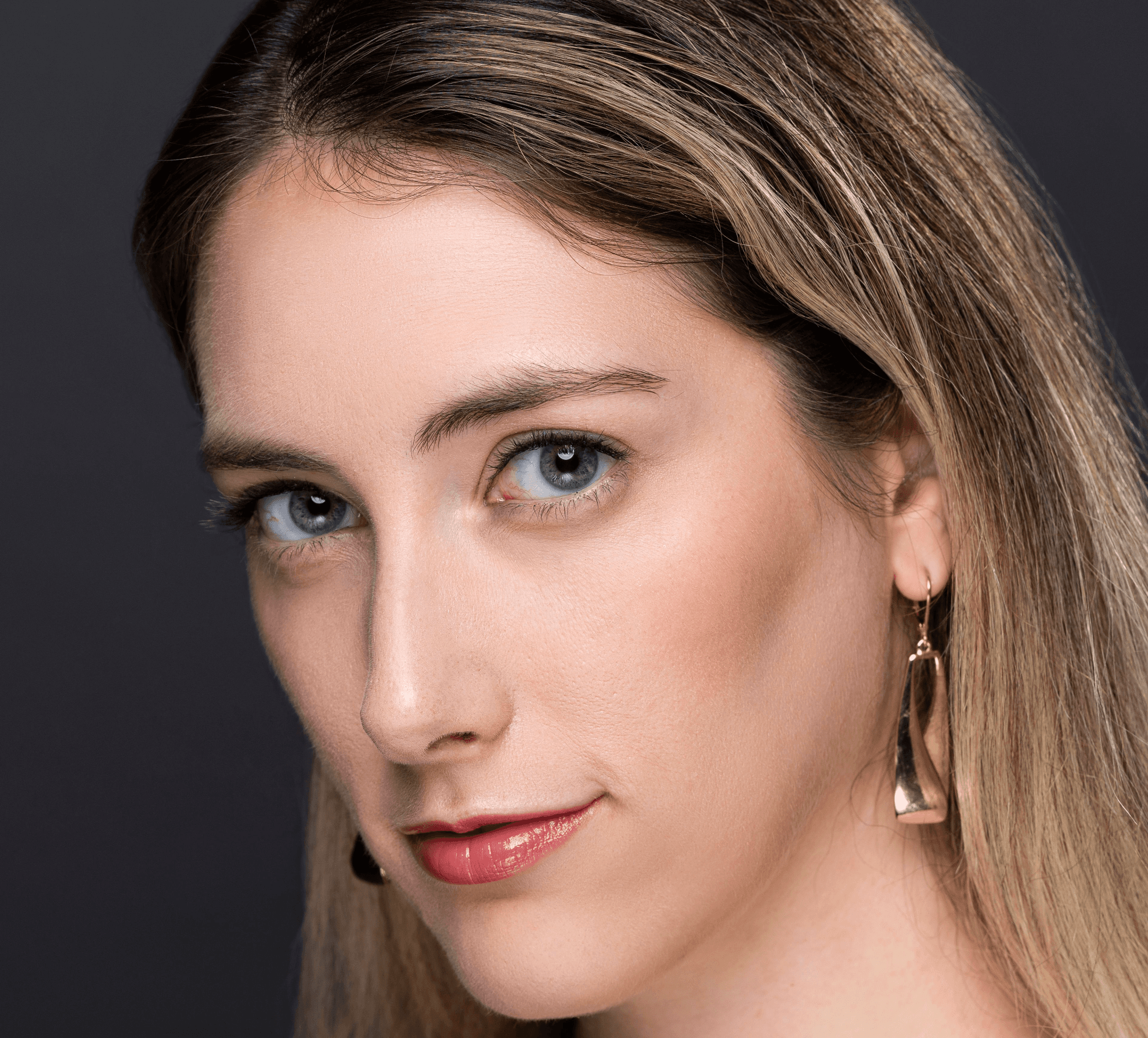 Woman with direct gaze wearing Elegant Effect lashes